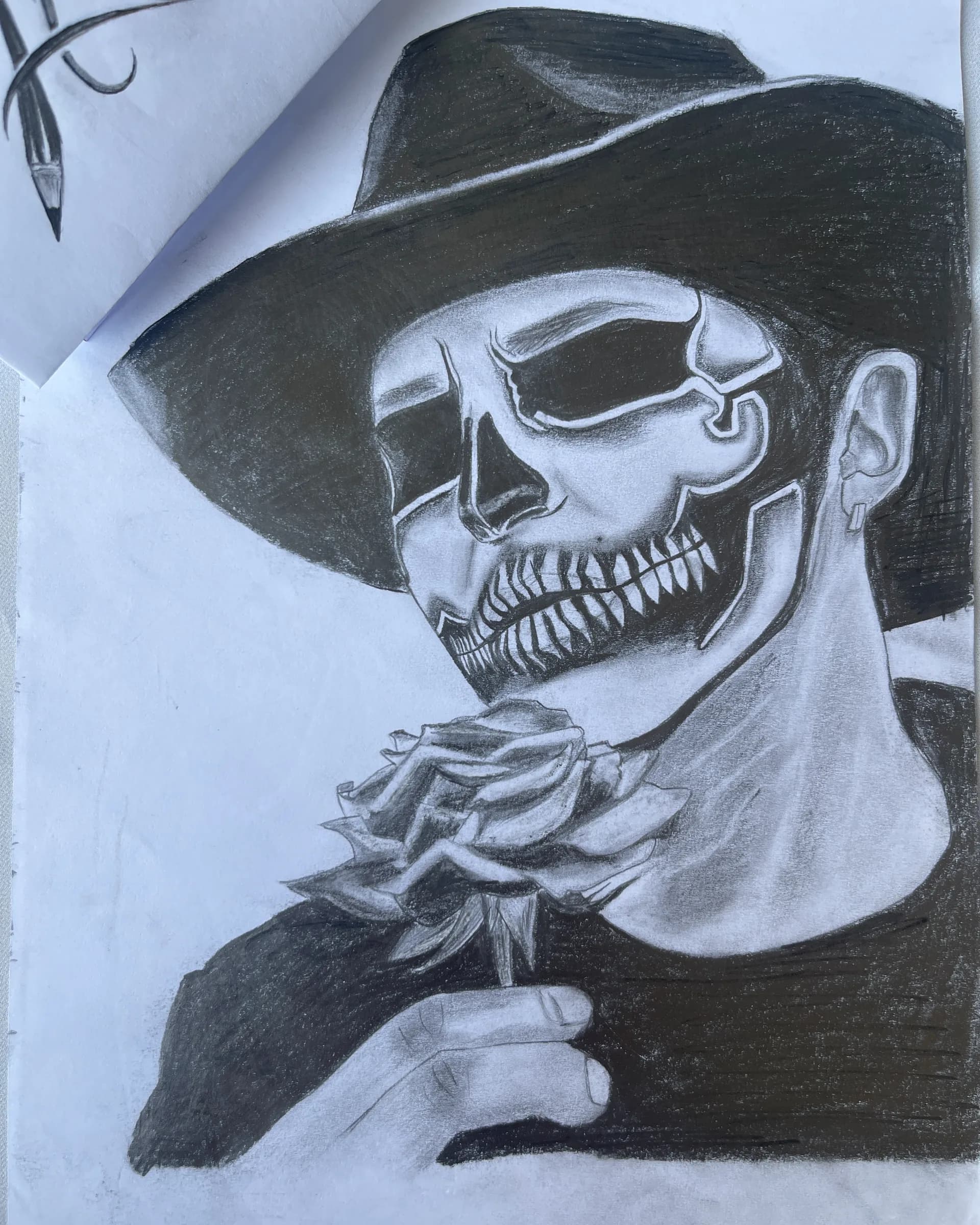 Hand-drawn graphite character artwork of a figure wearing a wide-brim hat and skeletal mask while holding a rose, created by Ammama Sketch.