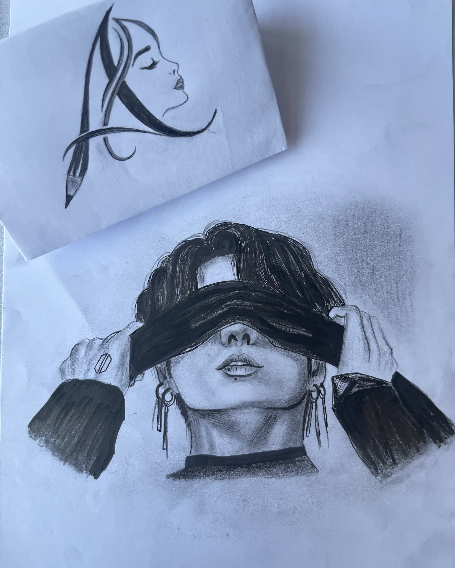 Hand-drawn graphite portrait of a stylish character holding a dark fabric across the eyes, with detailed hair, jewelry, shading, and bold contrast by Ammama Sketch.