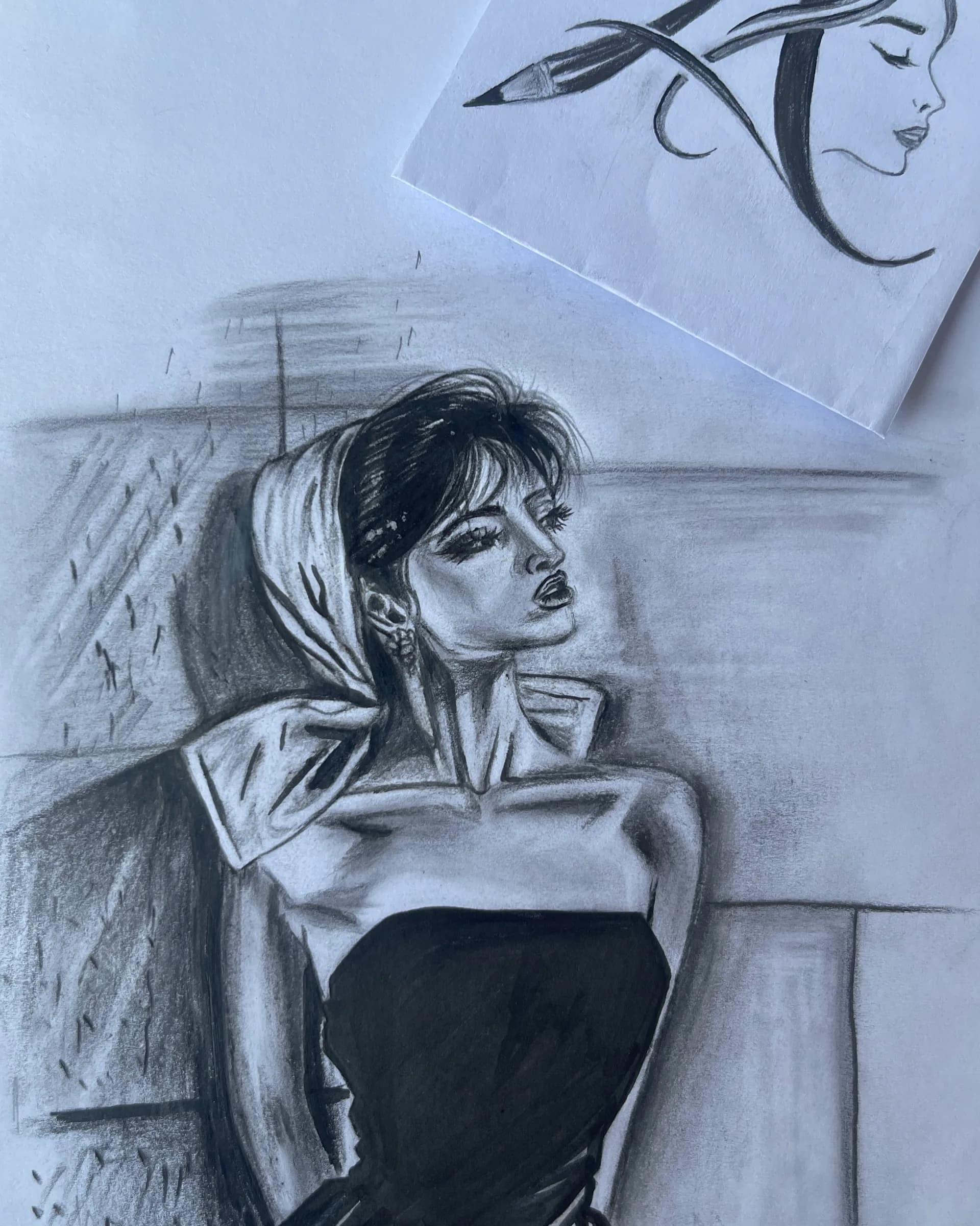 Hand-drawn graphite character portrait of a seated young woman in dark clothing with a dramatic collar, detailed hair, expressive features, and cinematic shading by Ammama Sketch.