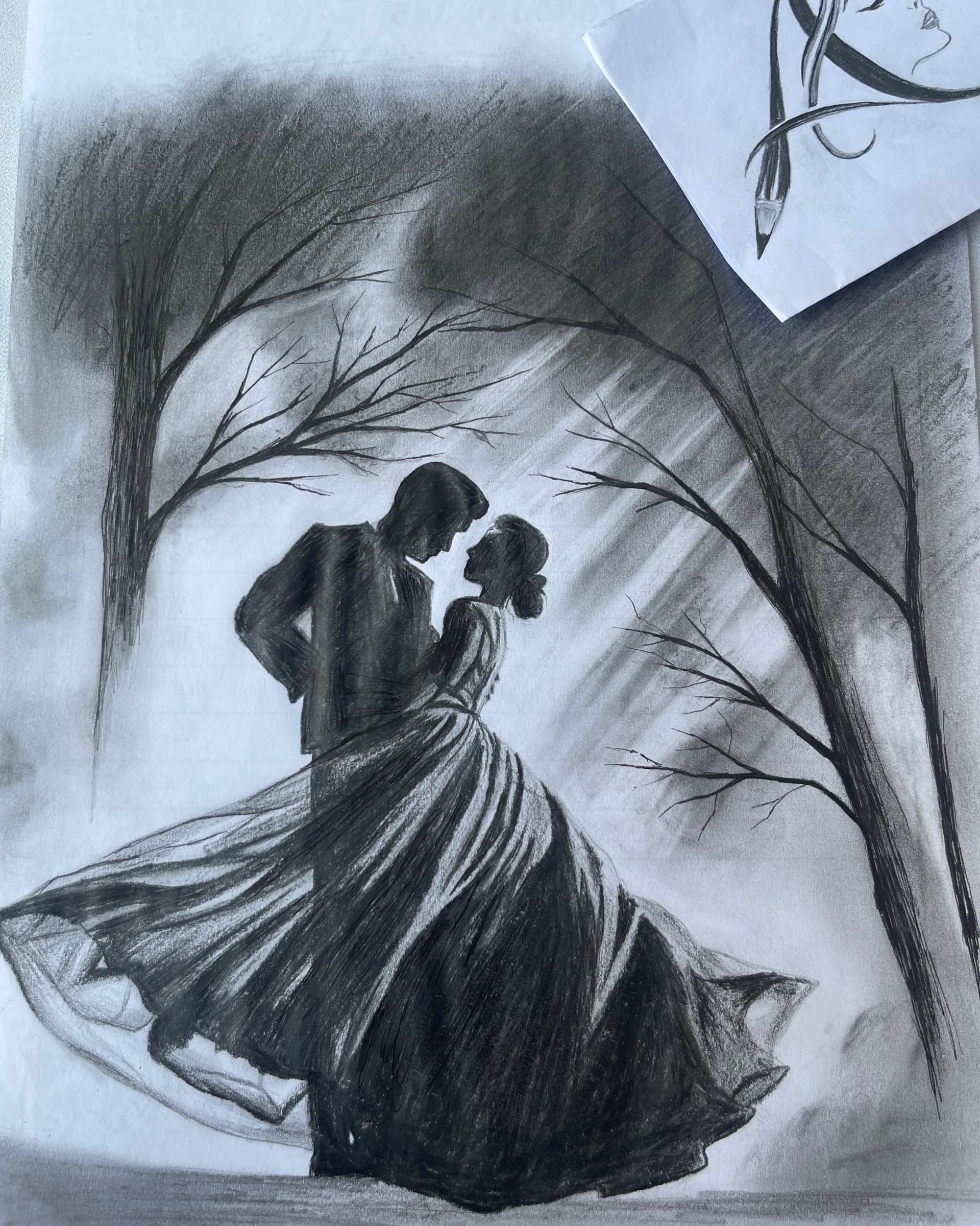 Hand-drawn graphite scene featuring two silhouetted figures beneath flowing fabric and bare tree branches, with dramatic shading and a cinematic atmosphere by Ammama Sketch.