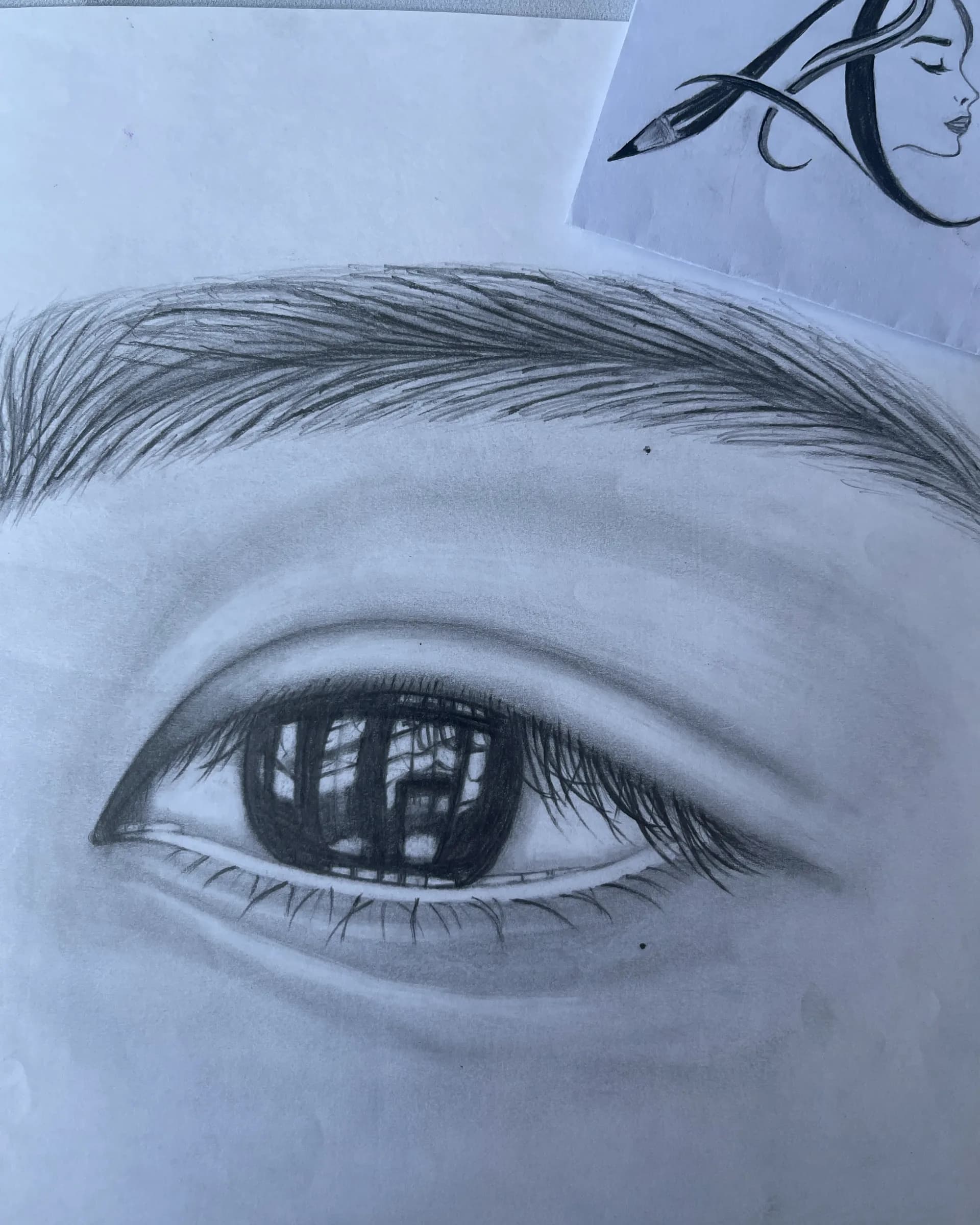 Close-up hand-drawn graphite eye study featuring detailed reflections, eyelashes, eyebrow texture, and realistic soft shading by Ammama Sketch.