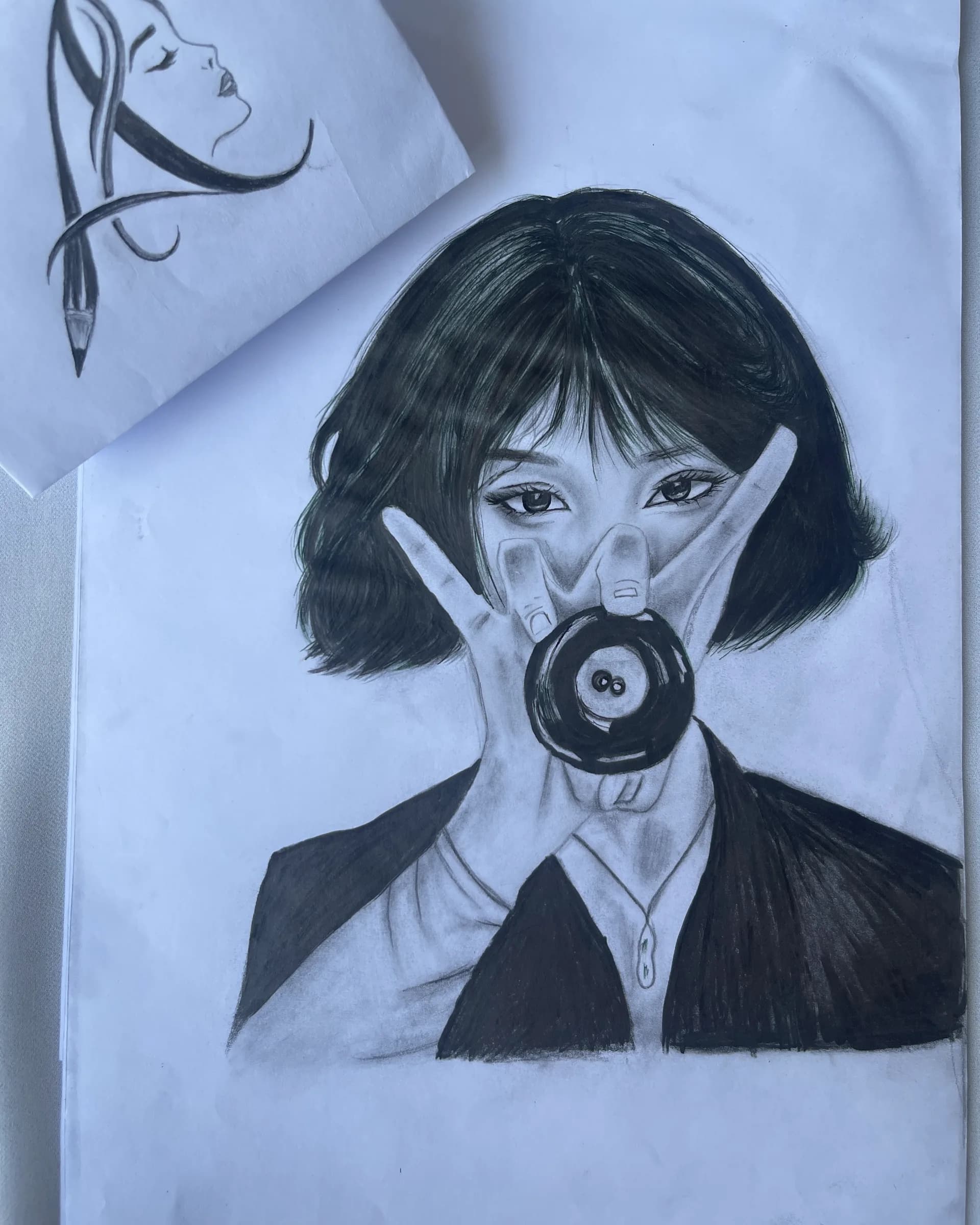 Hand-drawn pencil character portrait of a young woman with short dark hair, expressive eyes, and detailed shading by Ammama Sketch.